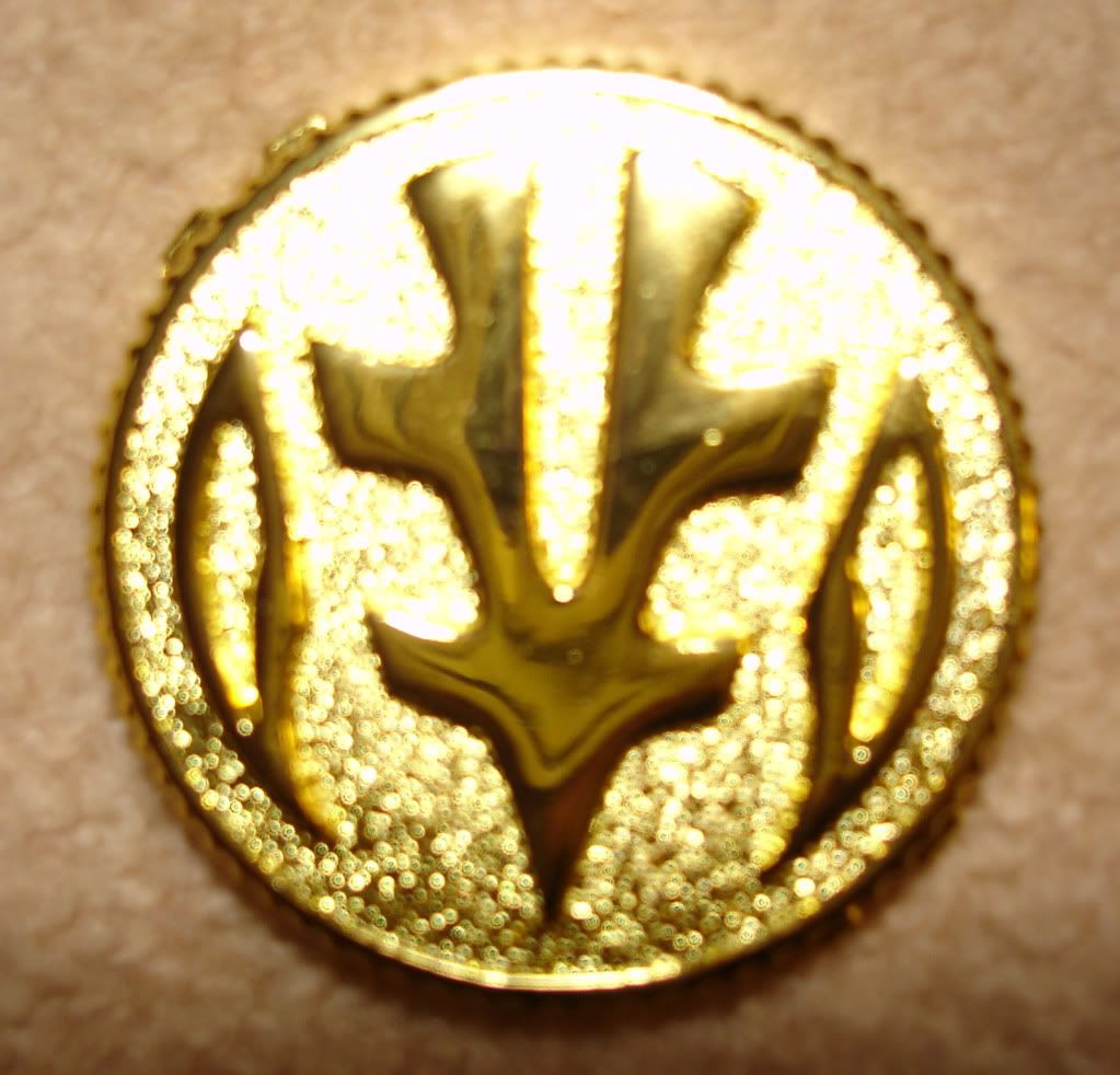 Jess's metal tigerzord coin front (so shiny!)